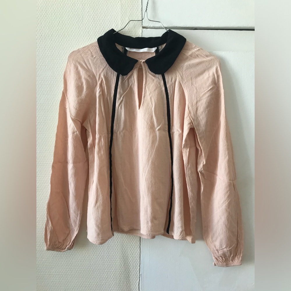 Salmon and black blouse